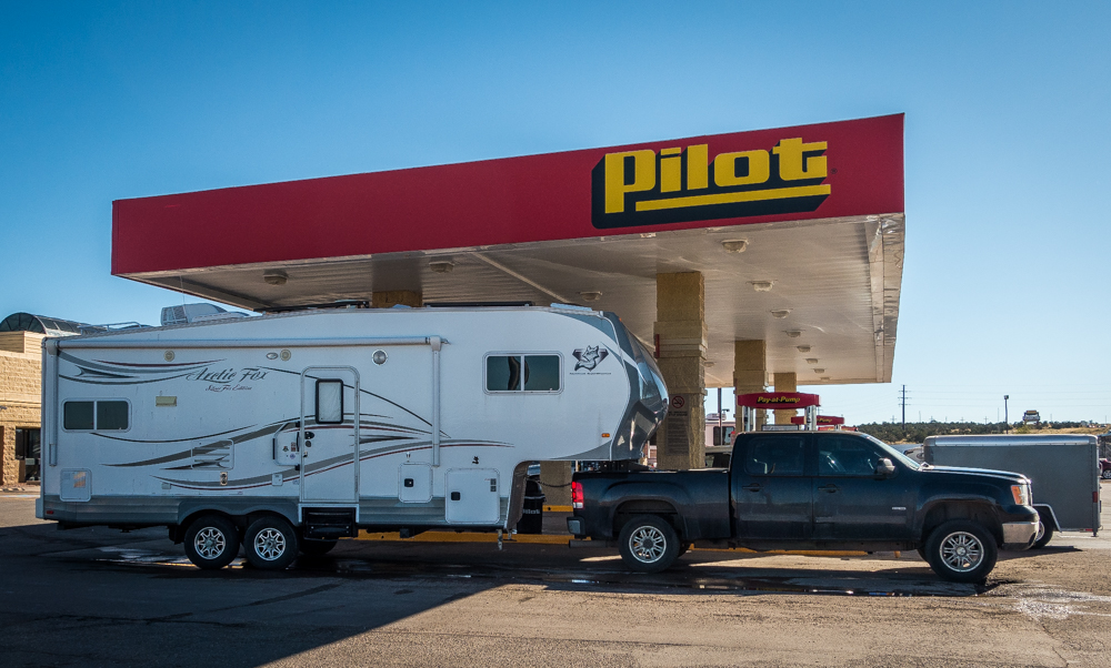 My Arctic Fox and GMC fueling up on highway 40 in NM.