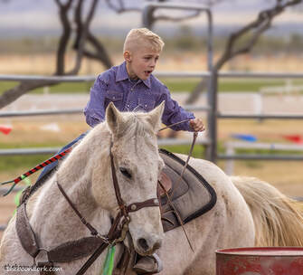 Young boy barrel racing Picture