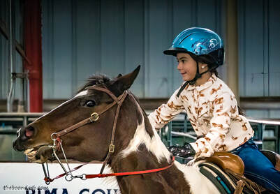 Young girl barrel racing Picture