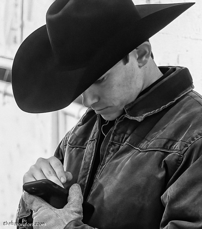cowboy using a cell phone