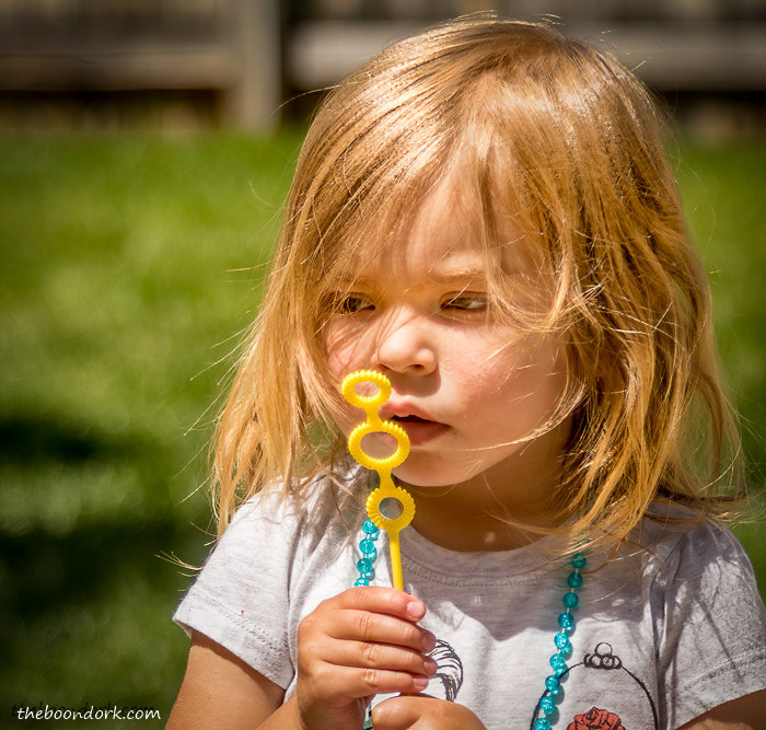 Granddaughter blowing bubbles